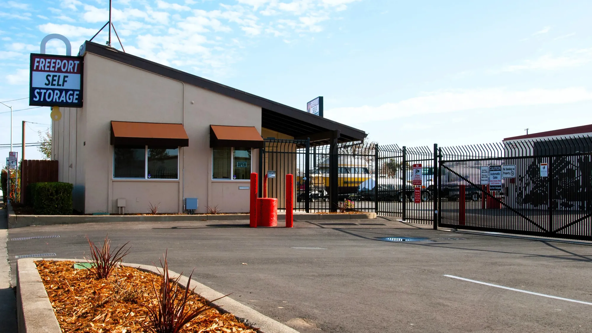 The Freeport Self Storage office in Sacramento, CA, next to the automatic entry gate