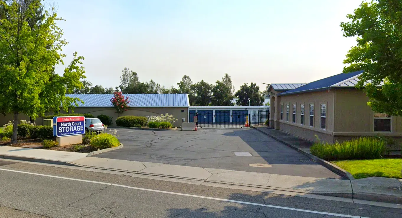 North Court Storage in Redding, CA, seen from the street: roadside sign, gated drive and office