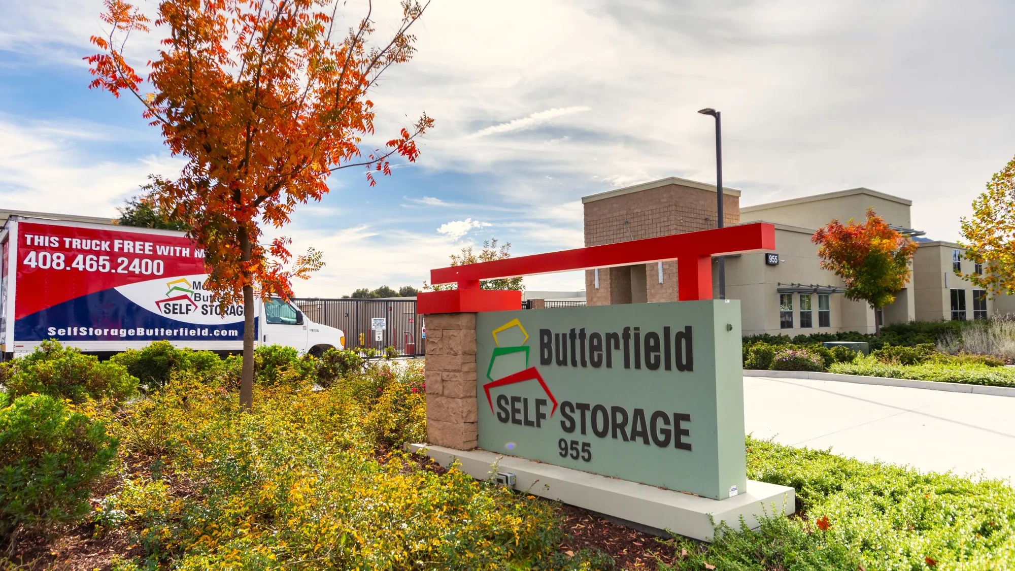 Butterfield Self Storage's monument sign at 955 in Morgan Hill, CA, framed by autumn trees