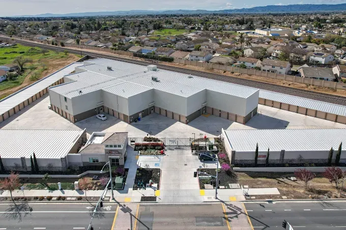 Aerial view of Cypress Self Storage in Oakley, CA, its V-shaped unit buildings and front office