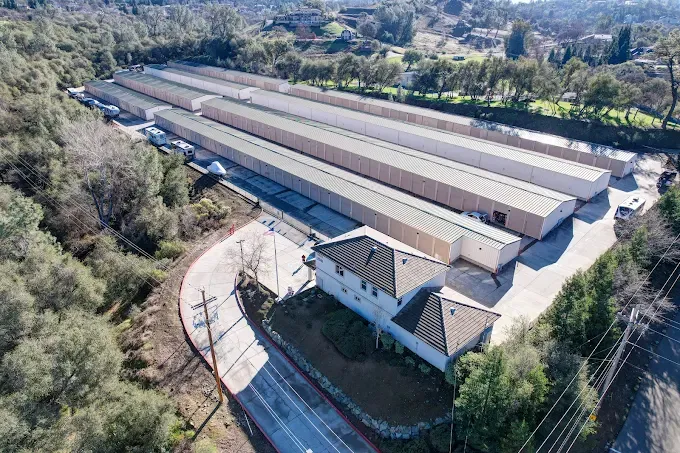 Aerial view of Green Valley Road Self Storage in El Dorado Hills, CA, on its wooded hillside site