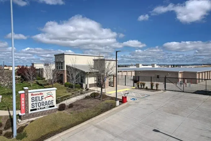 Roseville Self Storage's office and monument sign in Roseville, CA, beside the gated drive