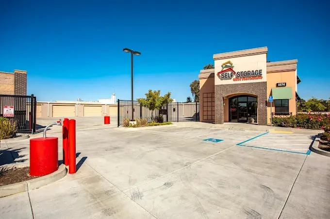 The arched office entrance and gated drive at West Sacramento Self Storage, West Sacramento, CA